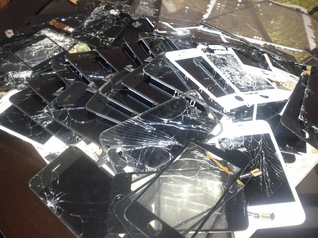 pile of broken iPhone screens