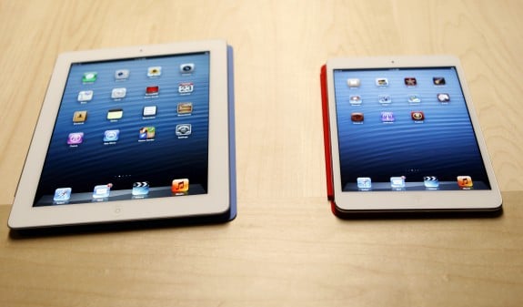 The new iPad mini is shown next to a full sized model at an Apple event in San Jose
