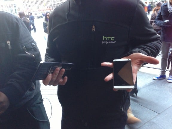An HTC rep shows off the HTC One at Samsung's Galaxy S4 Launch Event
