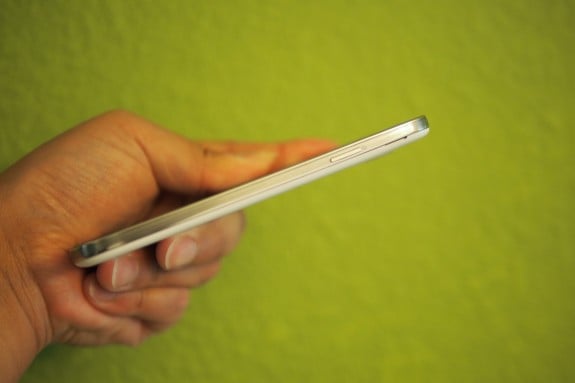 A more refined power button flank one side and a more refined volume rocker flank the opposite side edge of the phone. The metal buttons are a nice upgrade from the Galaxy S3's faux chrome finish.