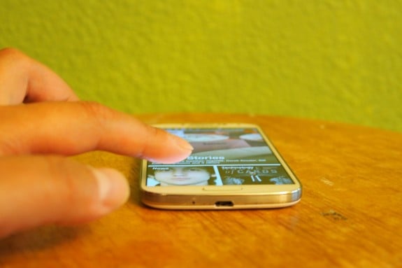 Metal-like band wraps around the phone and provides structural support.