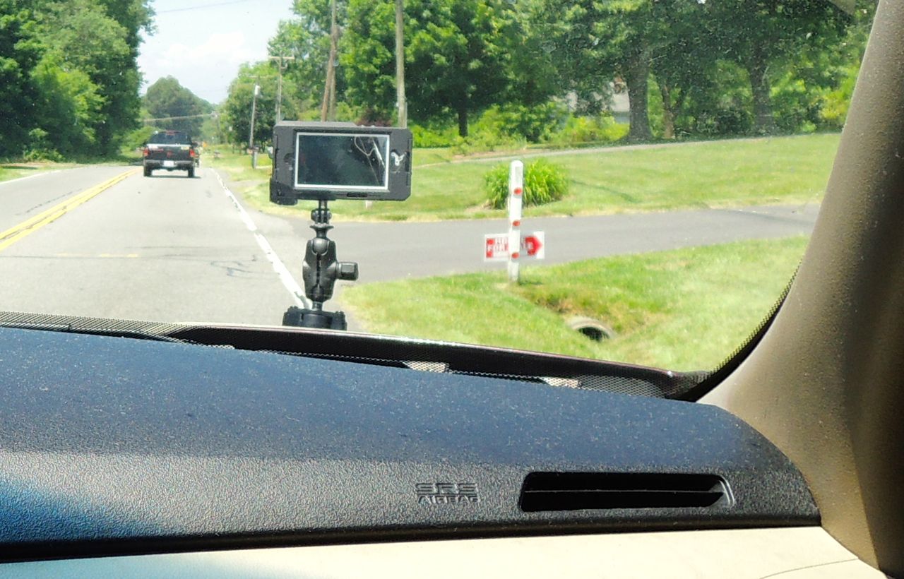 hitcase mounted on hood of car