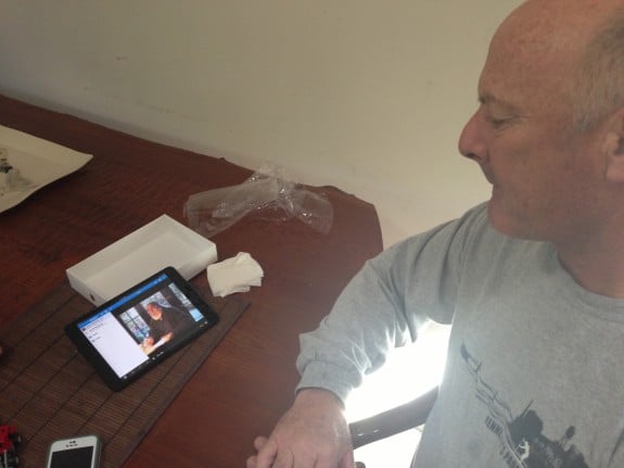 My father on his birthday watching a video of his dad