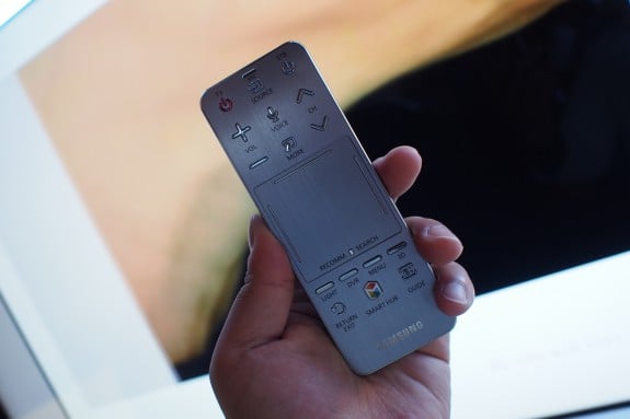 Speak your S Voice command into a small remote control with a multi-function trackpad. 