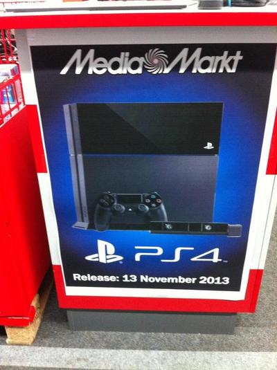 A poster at a major retailer shows a PS4 release date of November 2013.