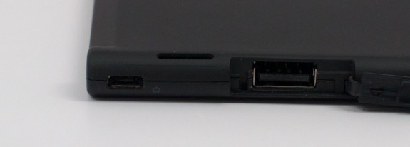 The ThinkPad Tablet 2 charges by Micro USB and includes a full size USB port for connecting a thumb drive.