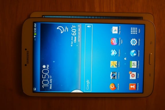 Size comparison: Galaxy Tab 3 8.0 stacked on top of the iPad mini, which is both shorter and more wide than the Samsung slate.