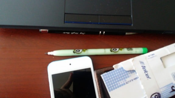 The Galaxy Note 3 can be seen in a reflection. 