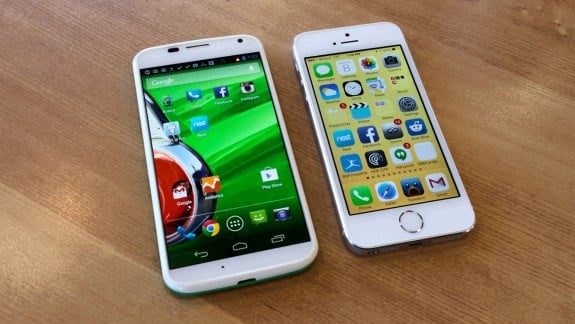 The Moto X features a 4.7-inch display and the iPhone 5s uses a 4-inch display, but the phones are similar in size.