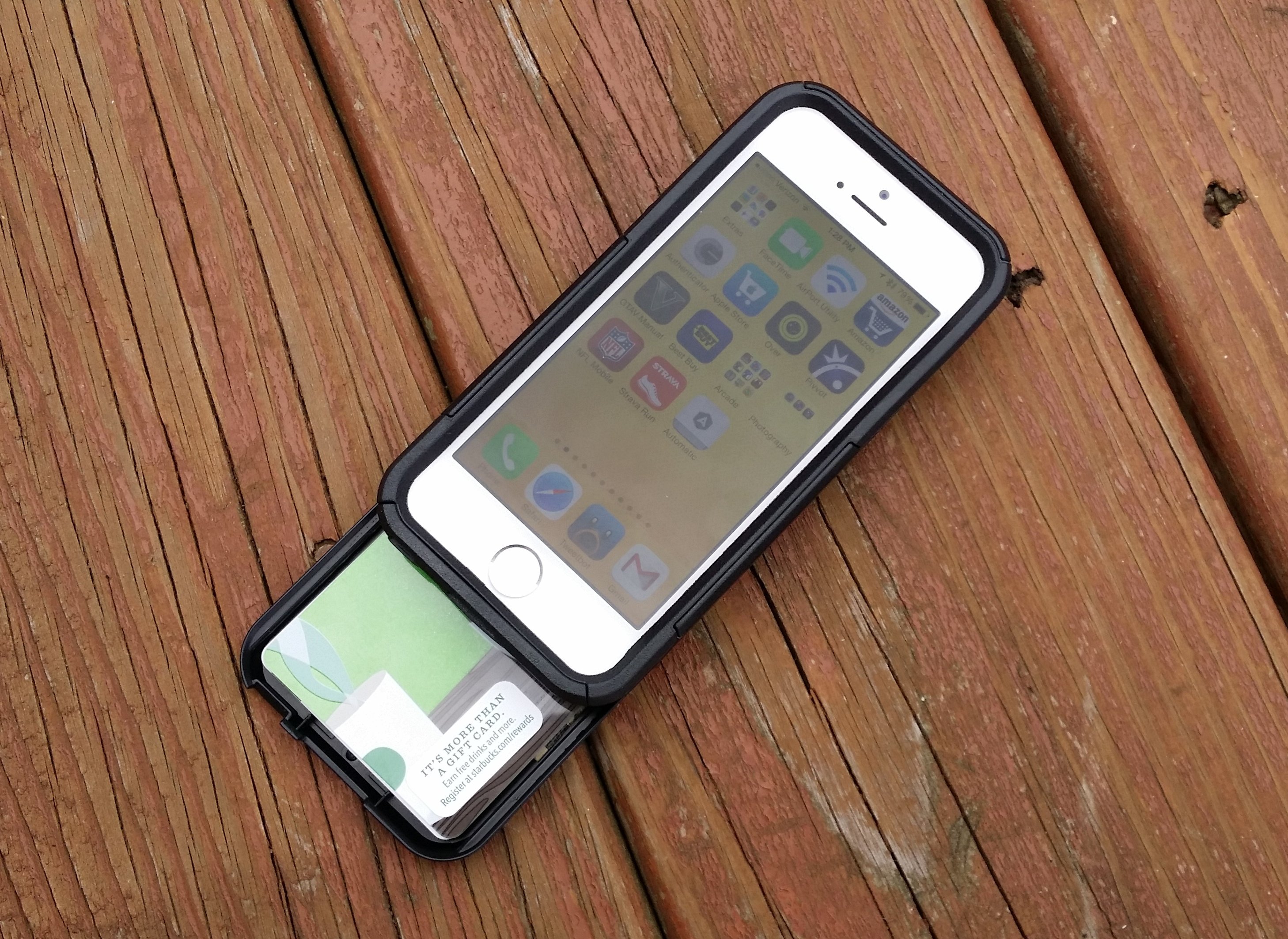 The iPhone 5s OtterBox Commuter Series Wallet holds three cards and one bill.
