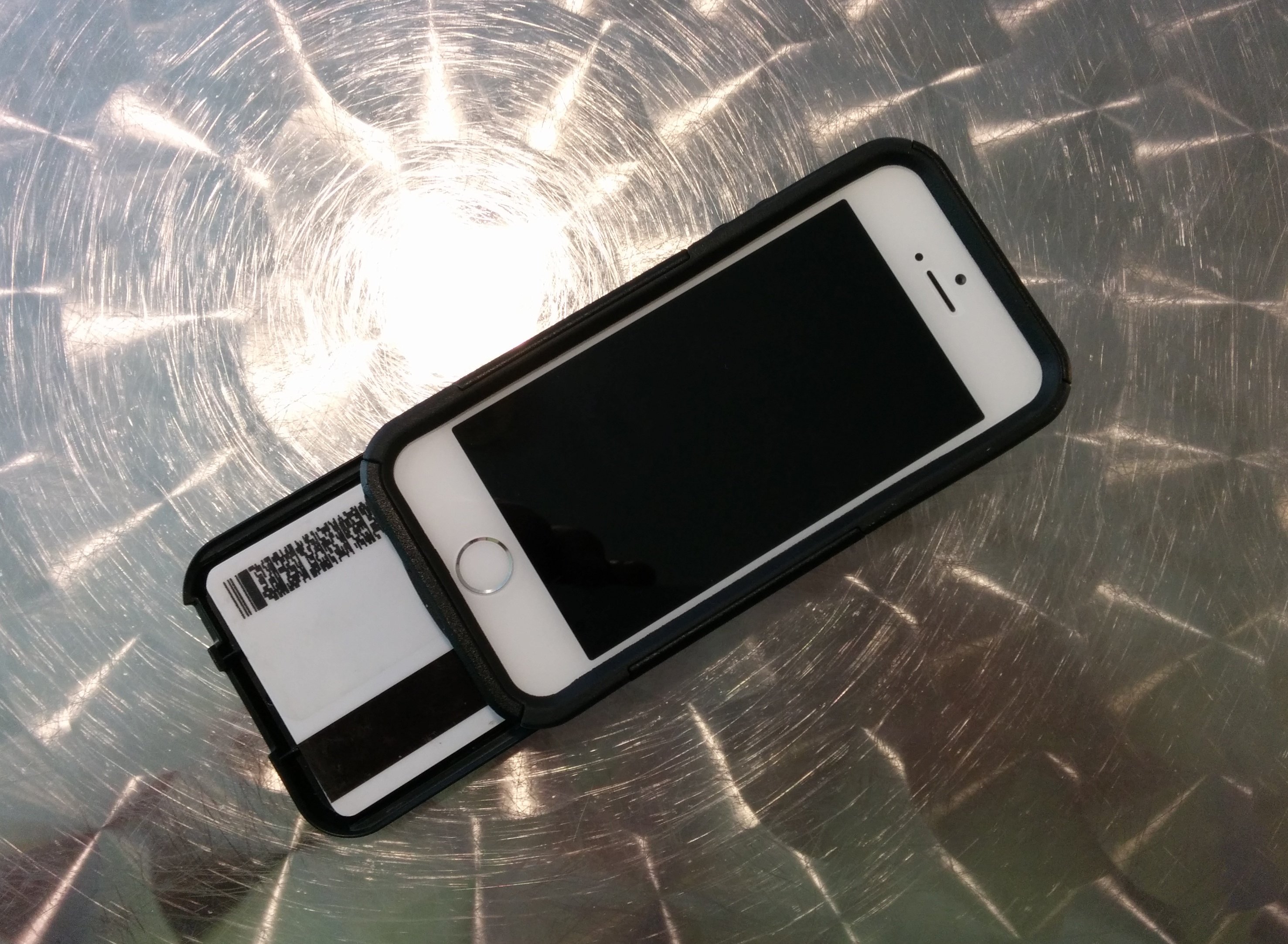 The OtterBox iPhone 5s Commuter Series Wallet offers protection and holds up to three cards.