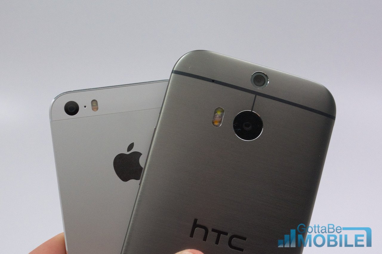 The new HTC One features two rear facing cameras, to the iPhone 5s' one.
