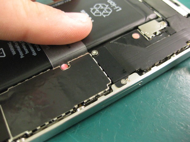 The pink sensor inside the iPhone indicates water damage and or exposure.