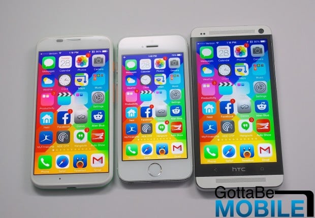 A Moto X on the left includes a 4.7-inch display, but is not much larger than the iPhone 5s with a 4-inch display.