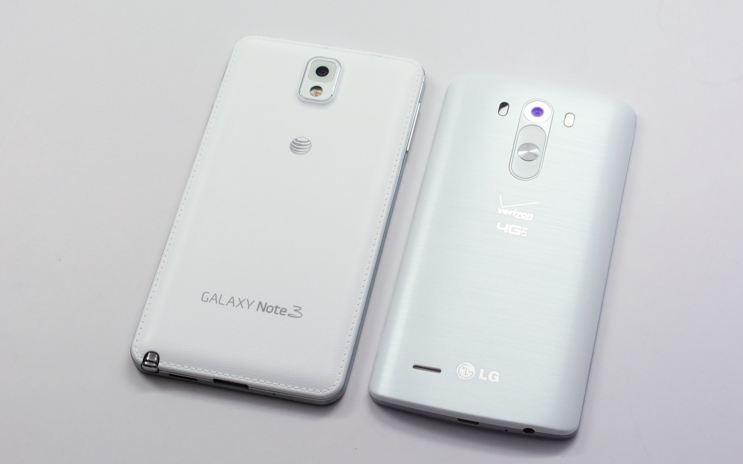 Both the LG G3 and Galaxy note 3 include plastic backs that pop off for access to storage and a replaceable battery.