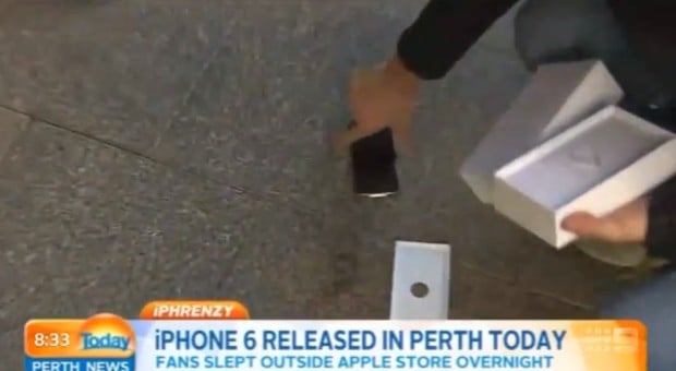 Watch as the first iPhone 6 buyer drops his new iPhone on the sidewalk.