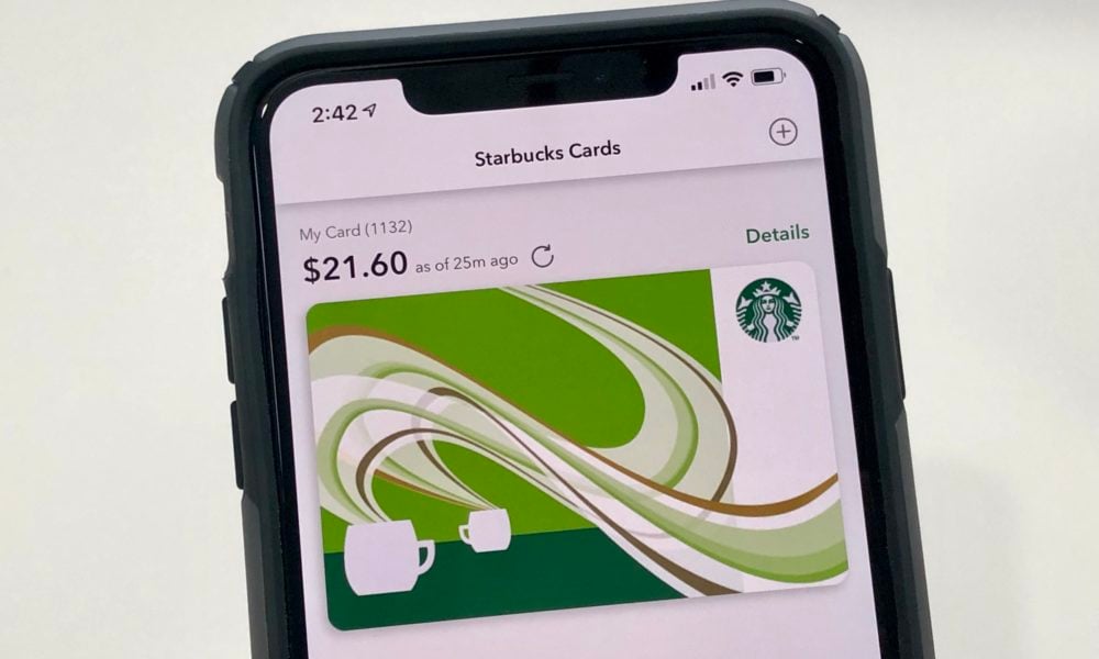 Starbucks gift card on iPhone screen.