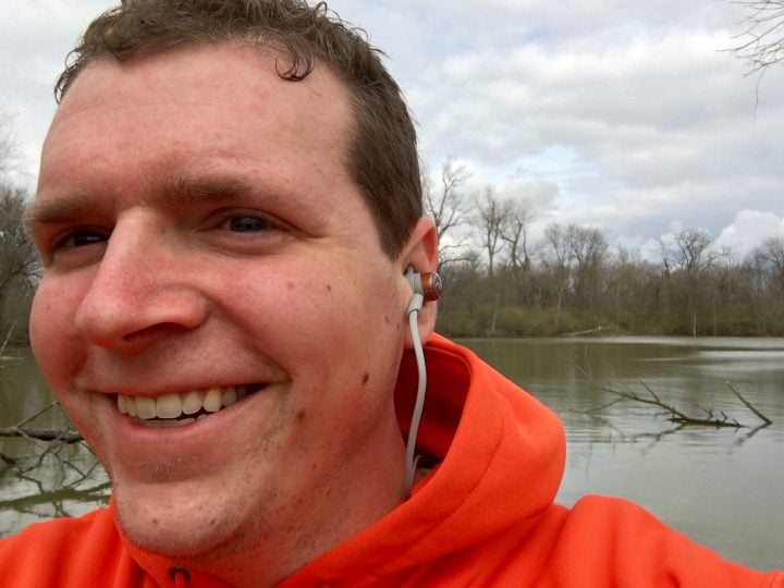The headphones fit well and stay put when running, but I did need to adjust one side due to sweat.