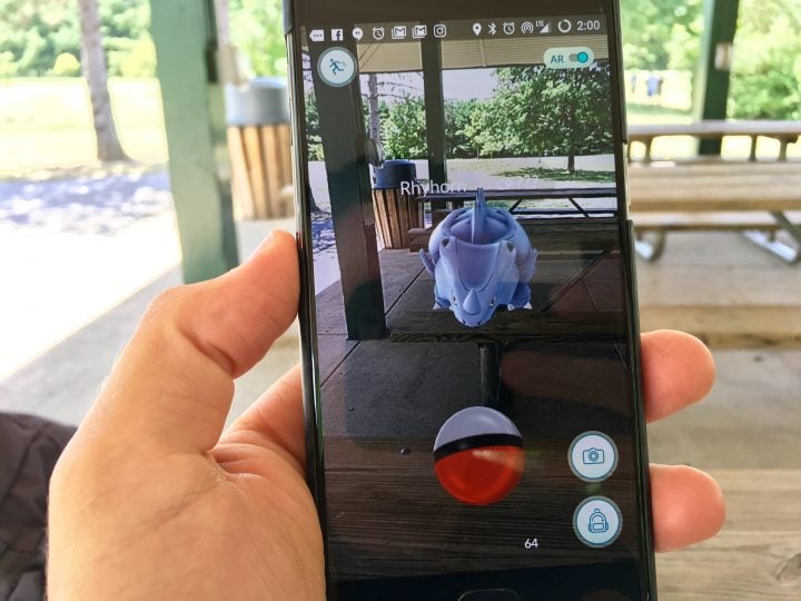 This is Pokémon Go. It is a game that uses your phone's location and mixes real and virtual worlds to catch Pokémon.