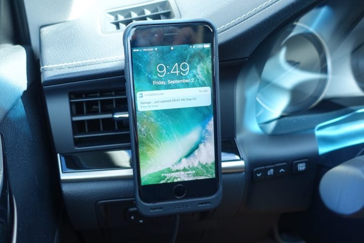 The iPhone stays on an easy to see vent mount magnetically and charges wirelessly.