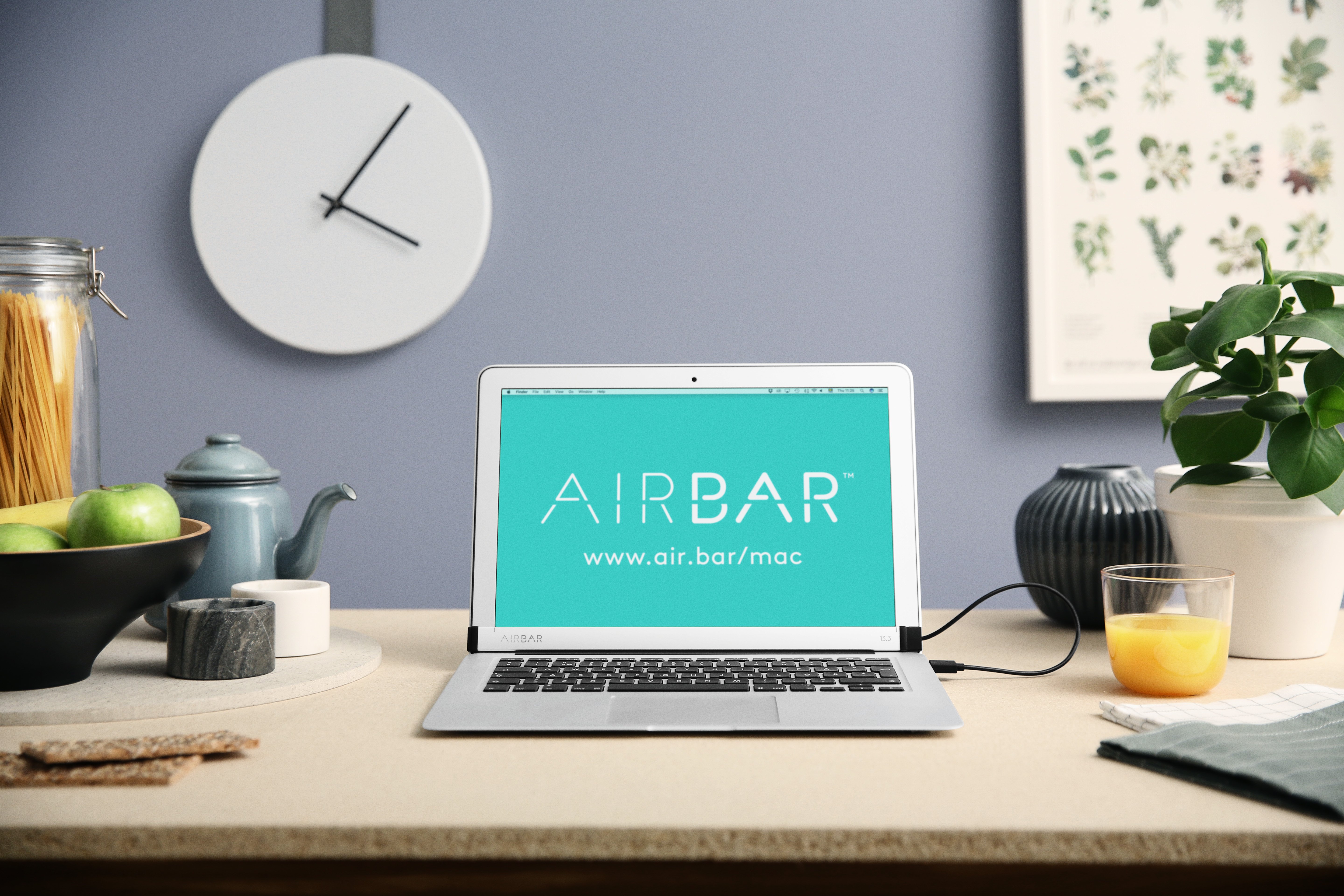 This is AirBar, an accessory that gives you a touchscreen Mac.