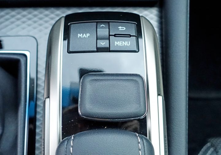 The infotainment controls are hard to use while driving.