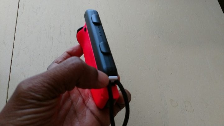 The release button on the Nintendo Switch Joy-Con Strap.