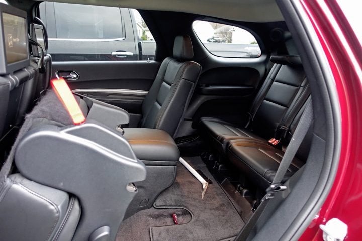 Upgrade to captain chairs in the center row for more comfortable seating and you still have easy access.