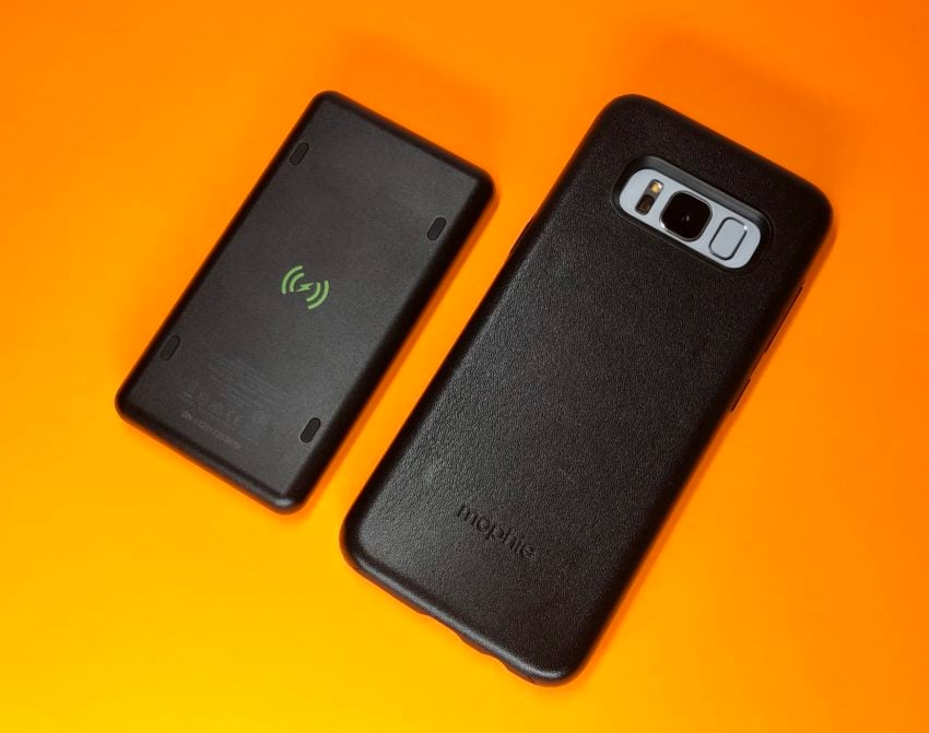 The leather case includes magnets to attach a wireless charging battery.