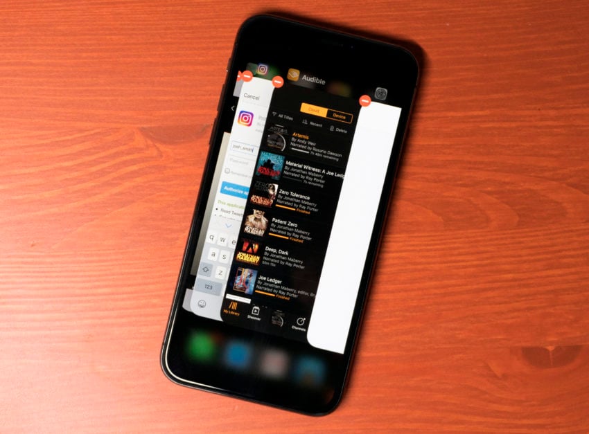 Force close running apps on the iPhone X.