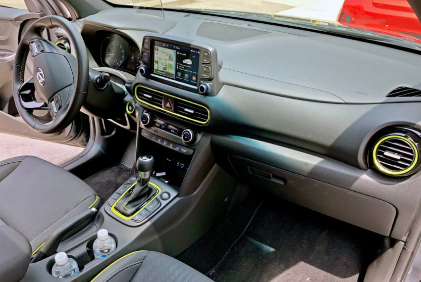 A roomy front seat area with easily reachable controls and optional lime accents.