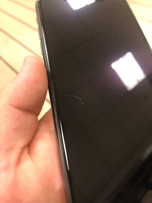 An iPhone 11 scratch shared by cperdue on the Apple Discussion Forums. 
