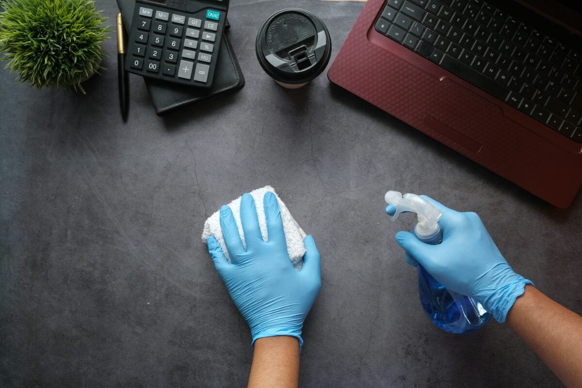 Cleaning tech devices on a desk